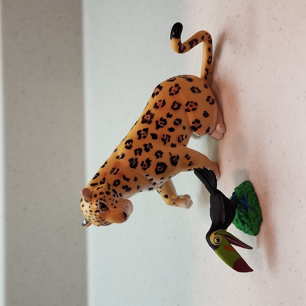 Disney encanto parce the jaguar and toucan